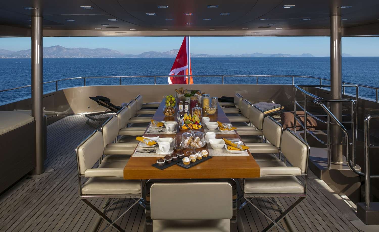 Exterior dining table crafted for a luxury yacht deck